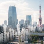 日経平均が一時1200円超高、アメリカの株高やイラン情勢の収束期待が影響する東京の景観を表現した画像です。